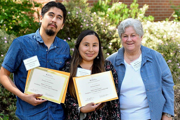 Marissa and Alex receiving scholarships